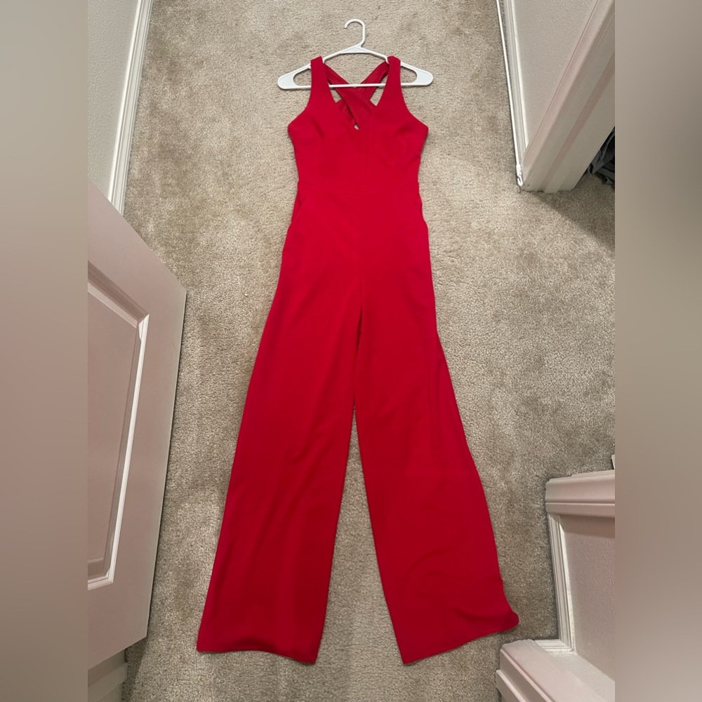 Red pants jumpsuit. Worn once. Size small. Excellent condition